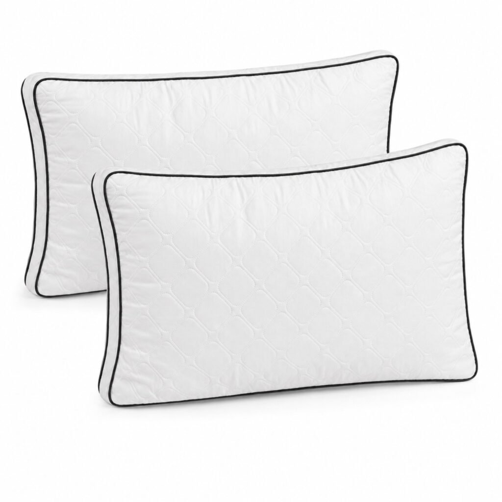 White quilted pillows with black piping
