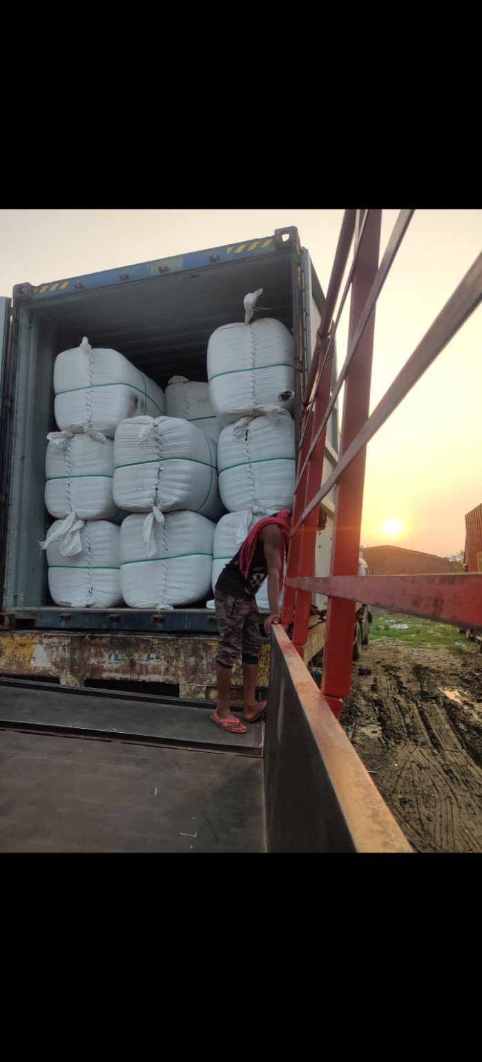 Compressed blanket bales being loaded for container export dispatch