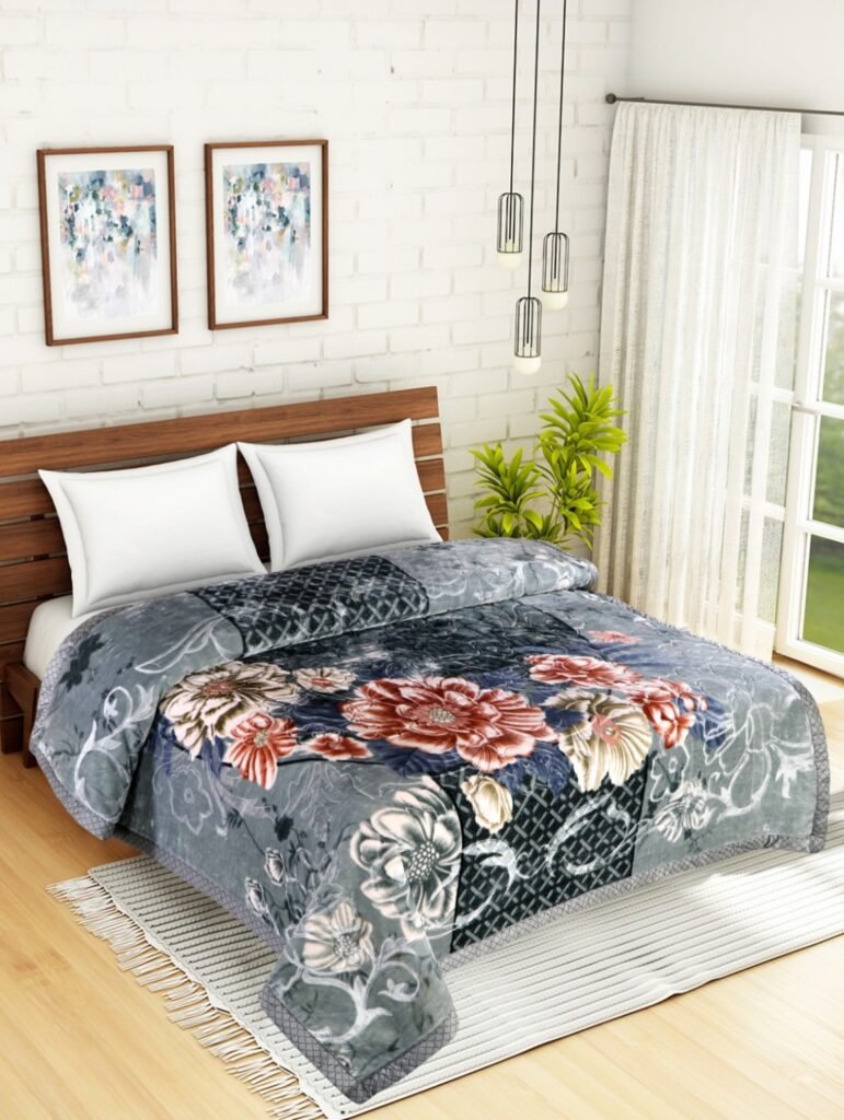Grey floral mink blanket displayed on a double bed