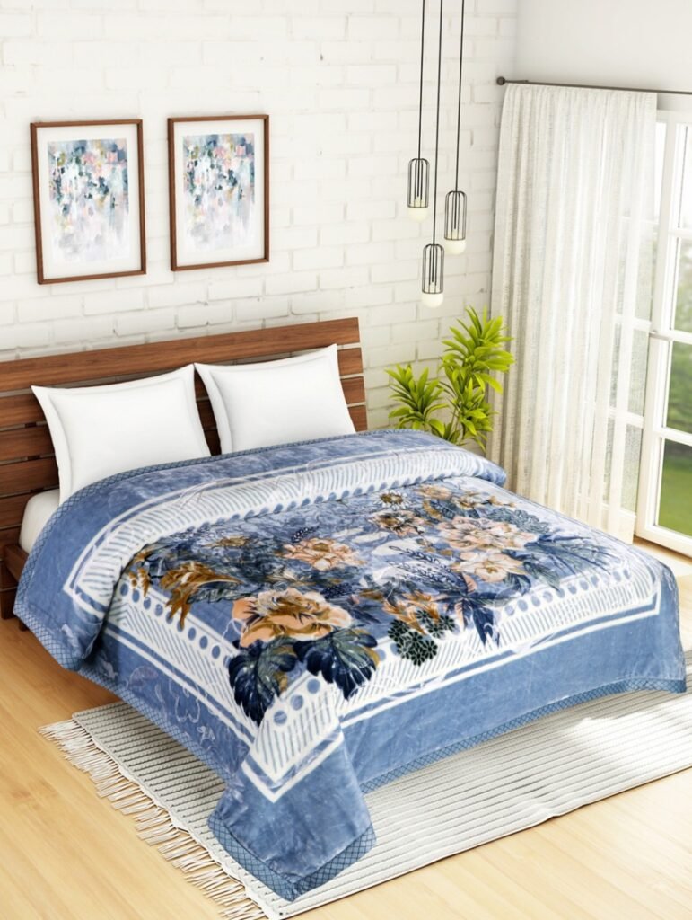 Blue floral mink blanket displayed on a double bed
