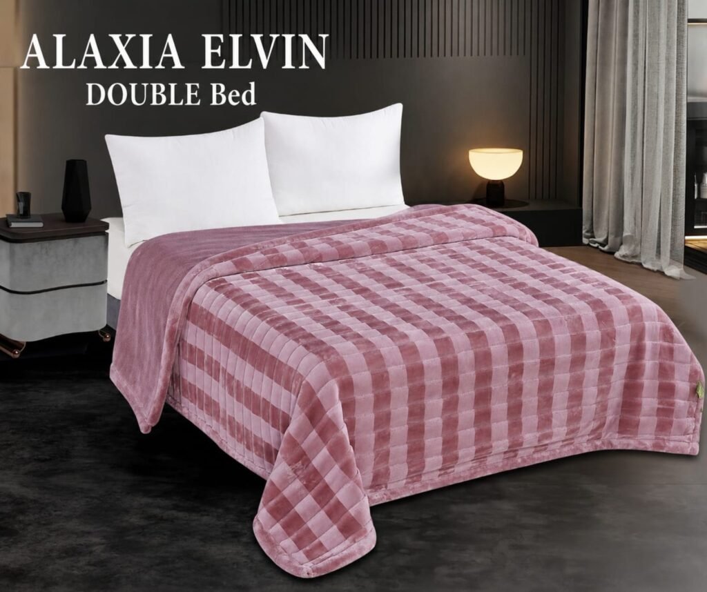 Pink check mink blanket displayed on a double bed