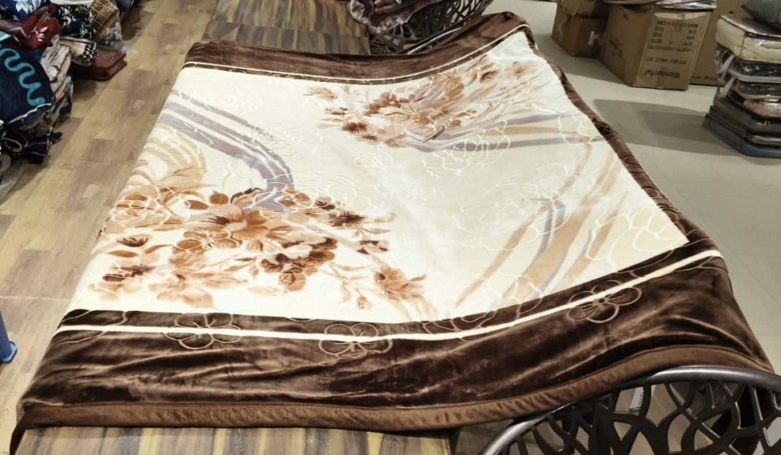 Brown floral mink blanket displayed in a showroom