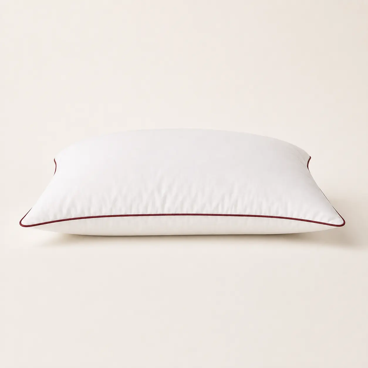 White piping pillow side profile showing loft